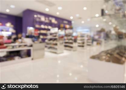 shoes selling in department store for use as shopping concept, blur background