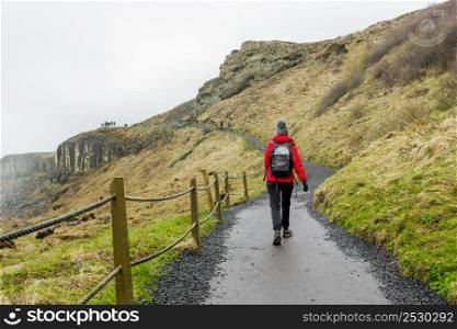 Shoot of a hiker woman walking at mountains in the winter