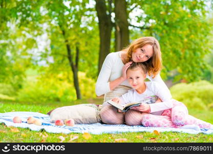 Shooting mother and daughter in the park on a picnic