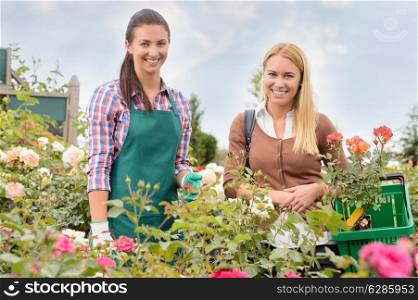 Shop assistant and customer woman in garden center smiling portrait