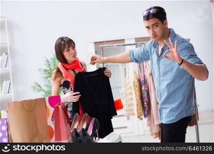 Shop assistant helping woman with buying choice