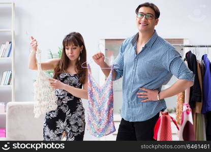 Shop assistant helping woman with buying choice