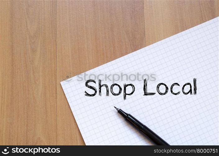Shop local text concept write on notebook with pen