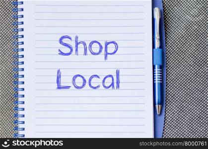 Shop local text concept write on notebook with pen