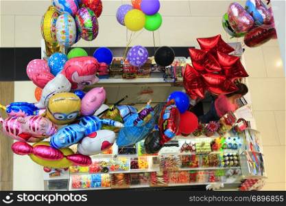 shop of color balloons and sweets. shop of different multicolored balloons and sweets. View from above