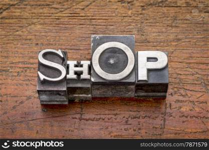 shop word in mixed vintage metal type printing blocks over grunge wood