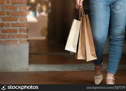Shopaholic woman with shopping bags, buying a lot of fashion clothes