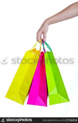Shopper holding shopping bags, in bright spring colors. Shot on white background.
