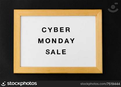 shopping and marketing concept - white magnetic board with cyber monday sale words on black background. magnetic board with cyber monday sale words