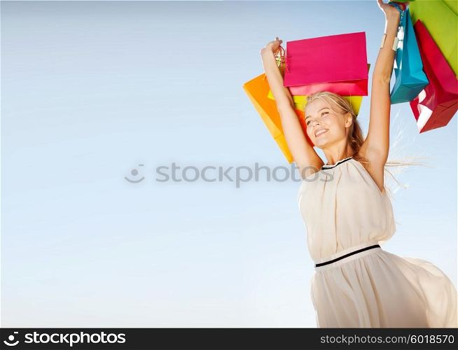shopping and tourism concept - woman with shopping bags. woman with shopping bags