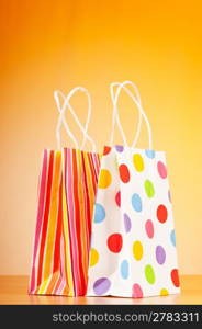 Shopping bags against gradient background