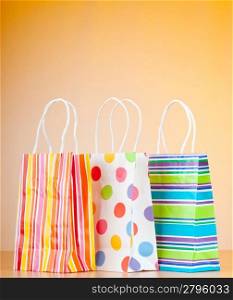 Shopping bags against gradient background