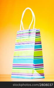 Shopping bags against gradient background