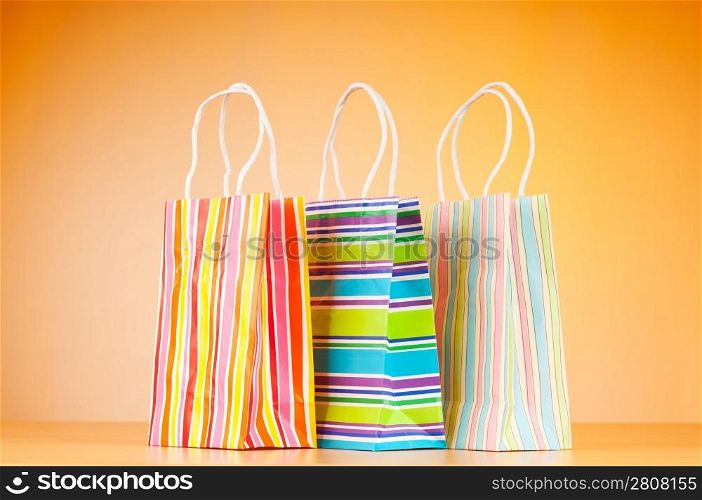 Shopping bags against gradient background