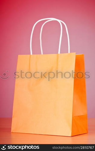 Shopping bags against gradient background