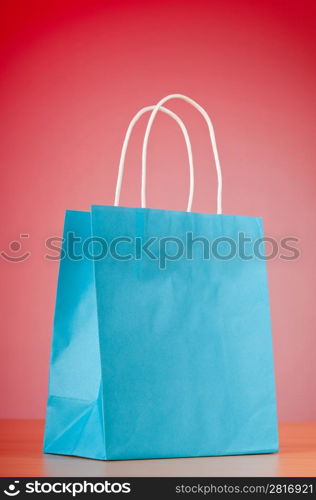 Shopping bags against gradient background