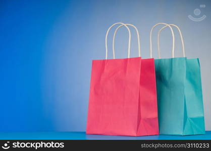 Shopping bags against gradient background