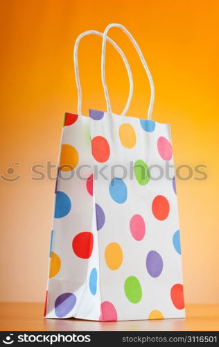 Shopping bags against gradient background