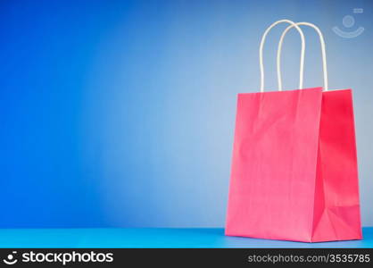 Shopping bags against gradient background