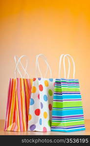 Shopping bags against gradient background