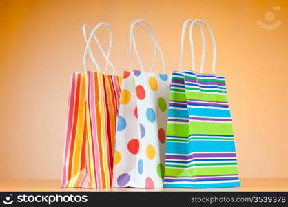 Shopping bags against gradient background