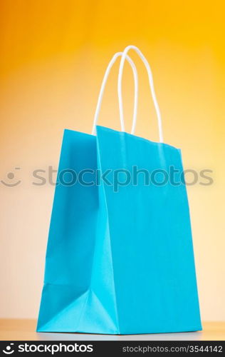 Shopping bags against gradient background