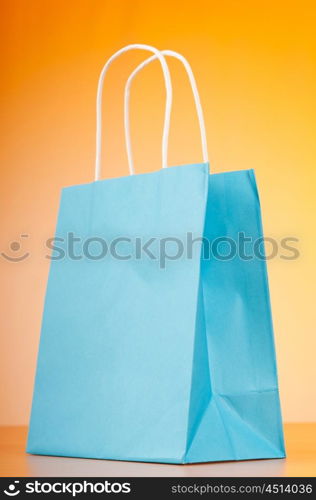 Shopping bags against gradient background