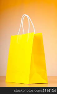 Shopping bags against gradient background