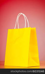 Shopping bags against gradient background