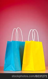 Shopping bags against gradient background