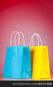 Shopping bags against gradient background