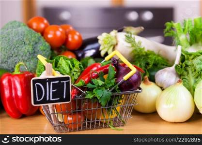 Shopping basket with diet sign and many colorful vegetables. Healthy eating lifestyle, vegetarian food.. Shopping backet with dieting vegetables