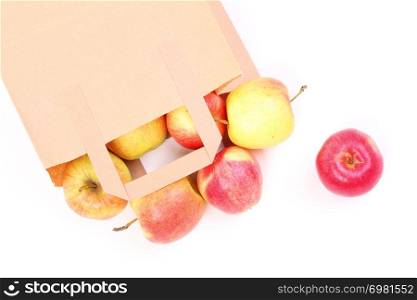 Shopping brown recycle gift bags and red apple isolated on white background