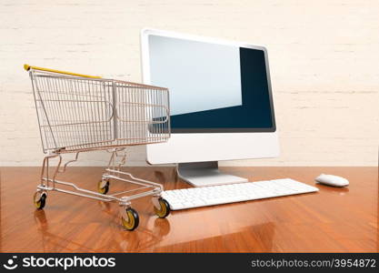 Shopping cart and computer on hardwood table