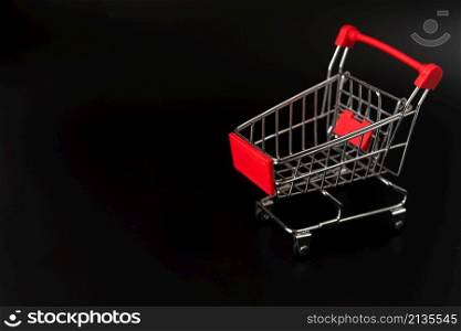 shopping cart dark background with copy space