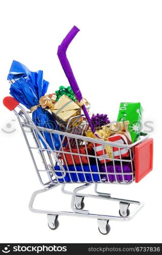 Shopping cart full of different christmas presents on a white background
