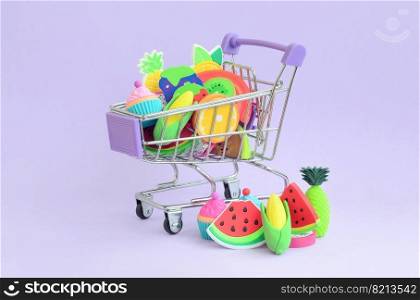 Shopping cart is filled to the top with fresh fruits on a purple background. The concept of buying food and fruit online. Diet food. Buying diet food and fruit online. Shopping cart