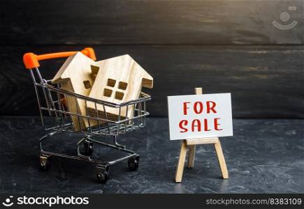 Shopping cart loaded with houses and sign for sale. Buying and selling housing. Saving money in real estate, investing in housing. Property appraisal. Secondary realty market. Attractive prices.