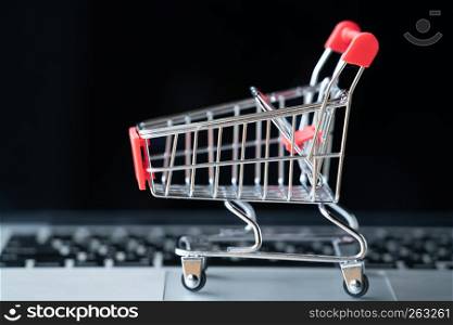 shopping cart on laptop, online shopping concept