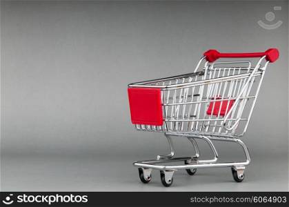 Shopping cart on seamless background