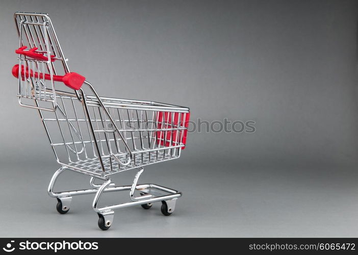 Shopping cart on seamless background