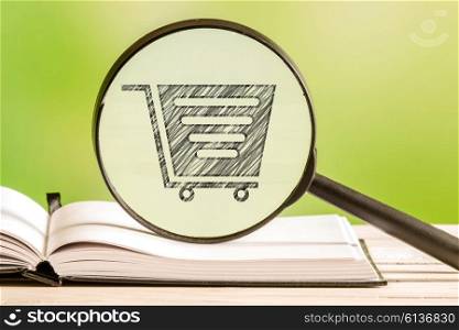 Shopping cart search with a pencil drawing of a cart in a magnifying glass