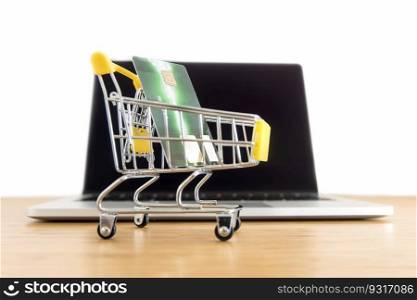 Shopping cart with credit card and laptop computer  for online shopping and delivery concept