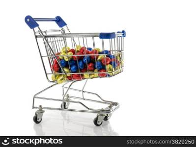 shopping cart with easter eggs isolated on white