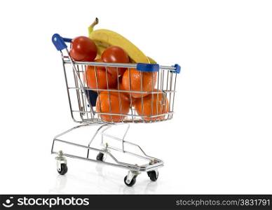 shopping cart with fresh fruit as bananas oranges and red tomato