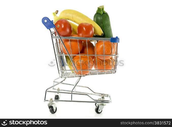 shopping cart with fresh fruit as bananas oranges and red tomatoand green gourgette