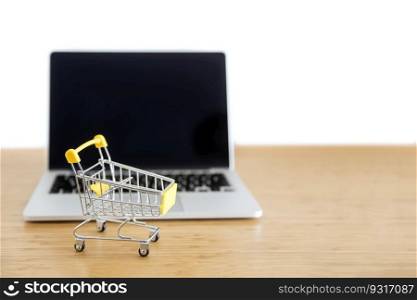 Shopping cart with laptop computer  for online shopping and delivery concept