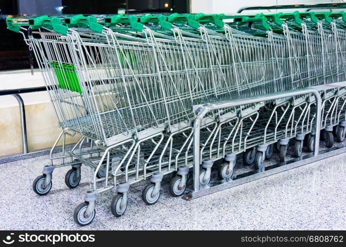 Shopping carts on a parking lot. Metal Shop carts