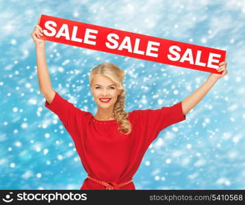 shopping, gifts, christmas, x-mas concept - smiling woman in red dress with sale sign