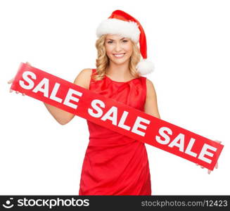 shopping, gifts, christmas, x-mas concept - smiling woman in santa helper hat with red sale sign